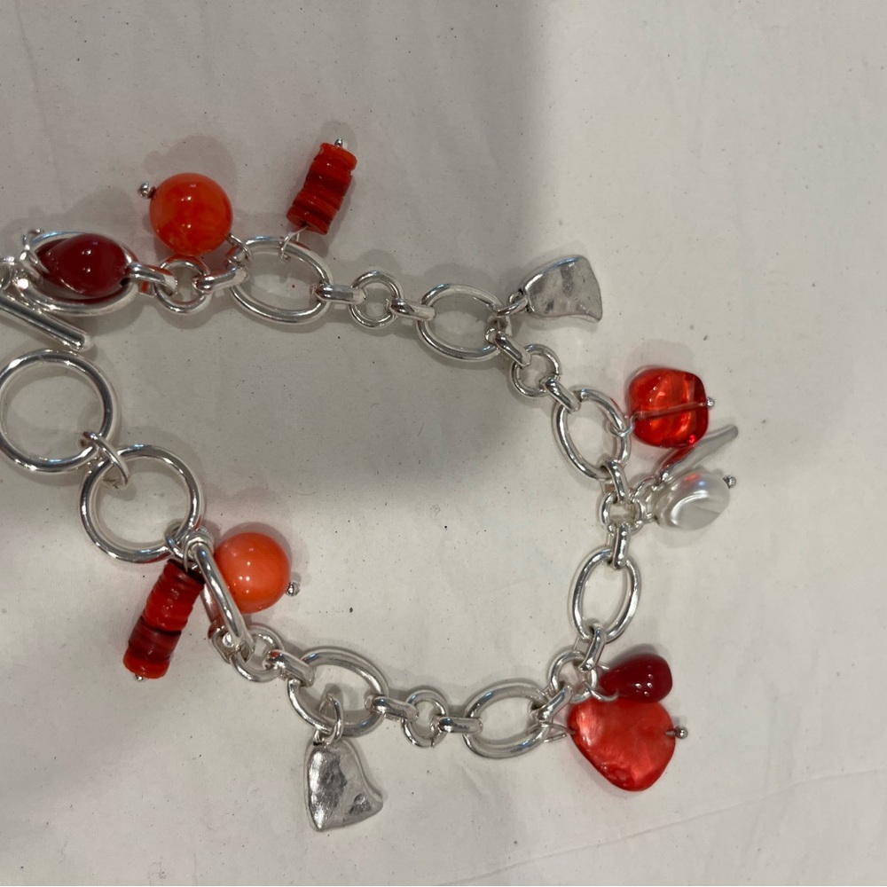 Red and silvered bracelet. New without tag . Never worn